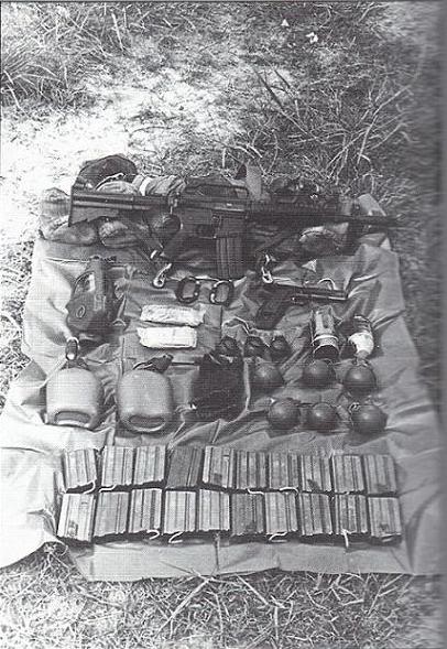 [SOG] <i>From book by MAJ John Plaster (Ret.) called SOG: A Photo History of the Secret Wars.</i>
On his web gear, a recon man carried 21 magazines, a pistol, canteens, a gas mask, and plenty of grenades.