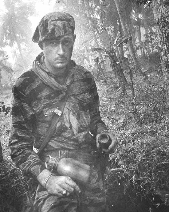[SOG] SOG medic Sgt Ben Roberts at a VC village in jungle.
Where they were removing the explosive from a dud 60mm mortar shell.